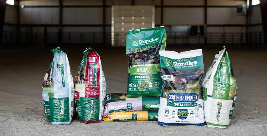 Standlee bagged forage products in riding arena.