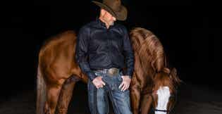 Clinton Anderson standing in front of horse