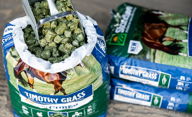 Bags and a bowl of Timothy Grass Chopped