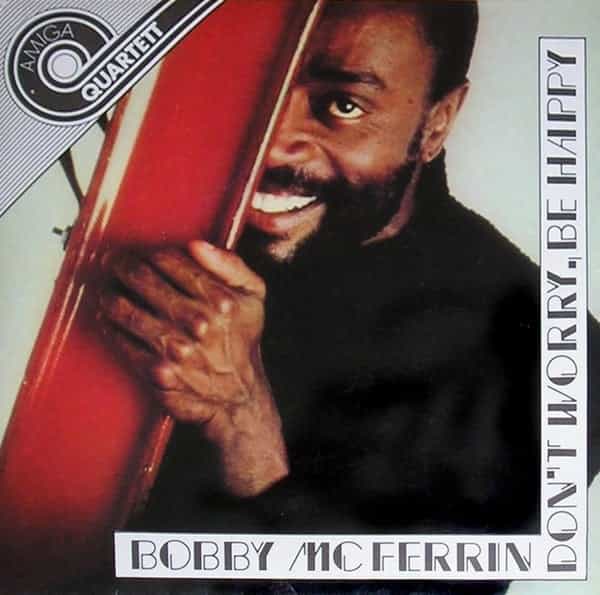 Album cover: Bobby McFerrin peeking from behind steel girder