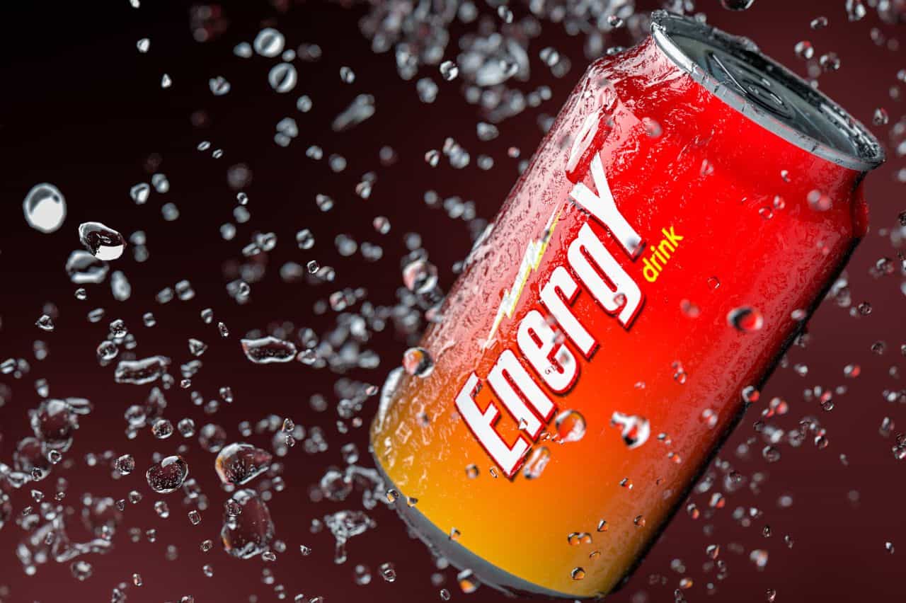 Can of energy drink amid splashing water