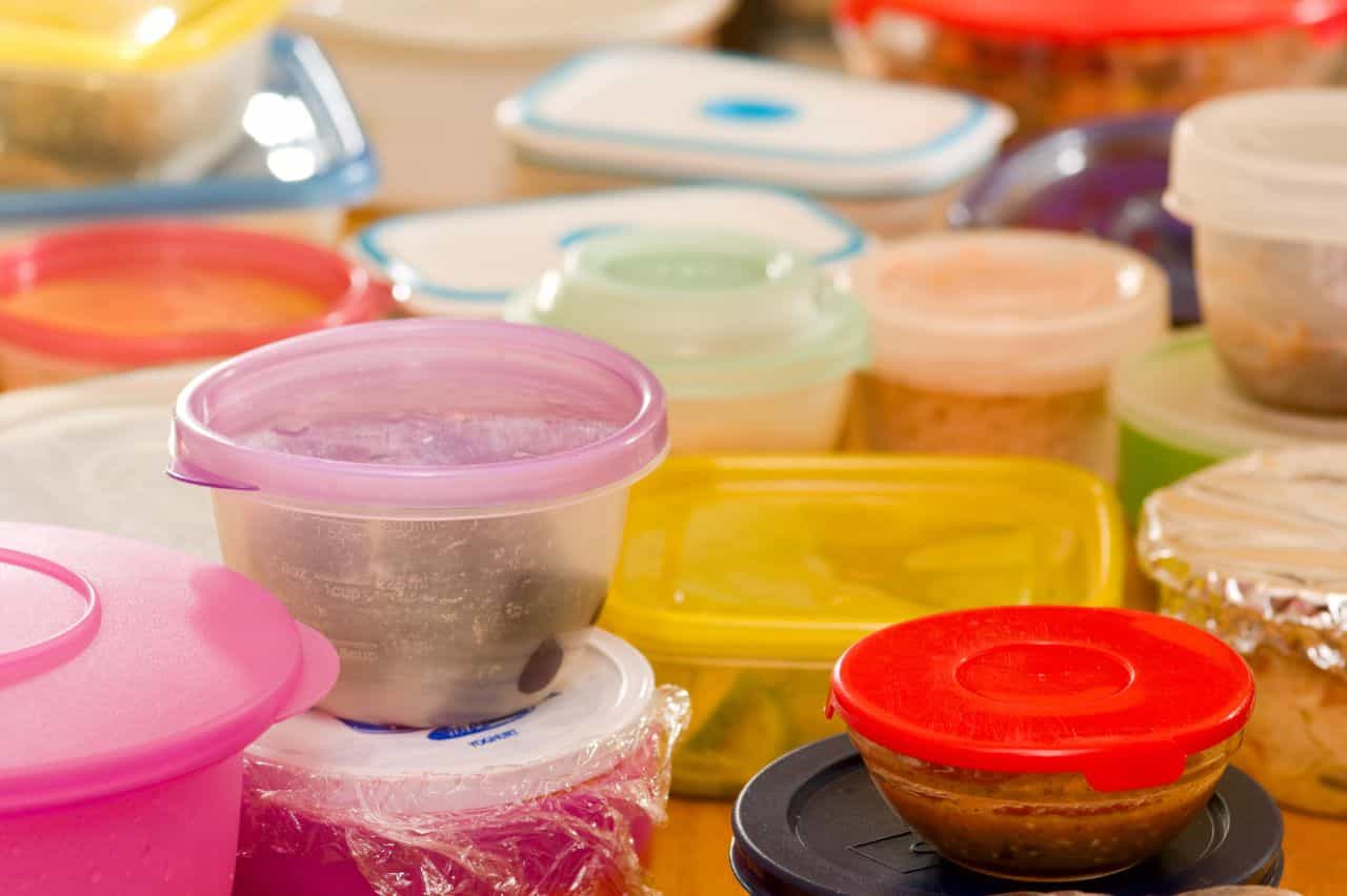 Several plastic containers of different colors and shapes